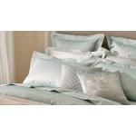 A bed with blue bedding