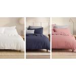 Three beds side-by-side, dressed in Bayley quilt cover sets in white, deep sea and rose