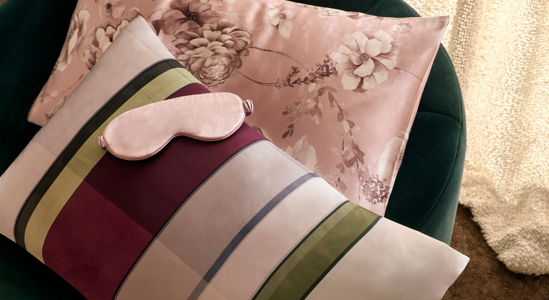 A bed with colourful bedding