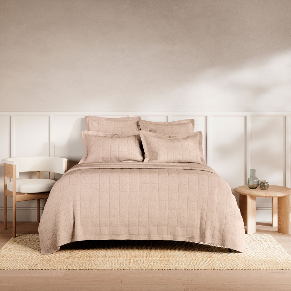 A bed with Abbotson Linen sheets and bed cover in the colour clay marle