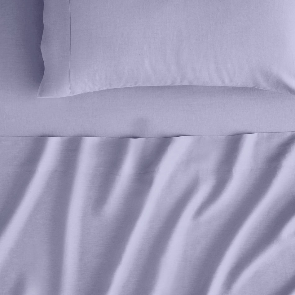 Close-up image of Abbotson Linen sheets in colour smoky violet.