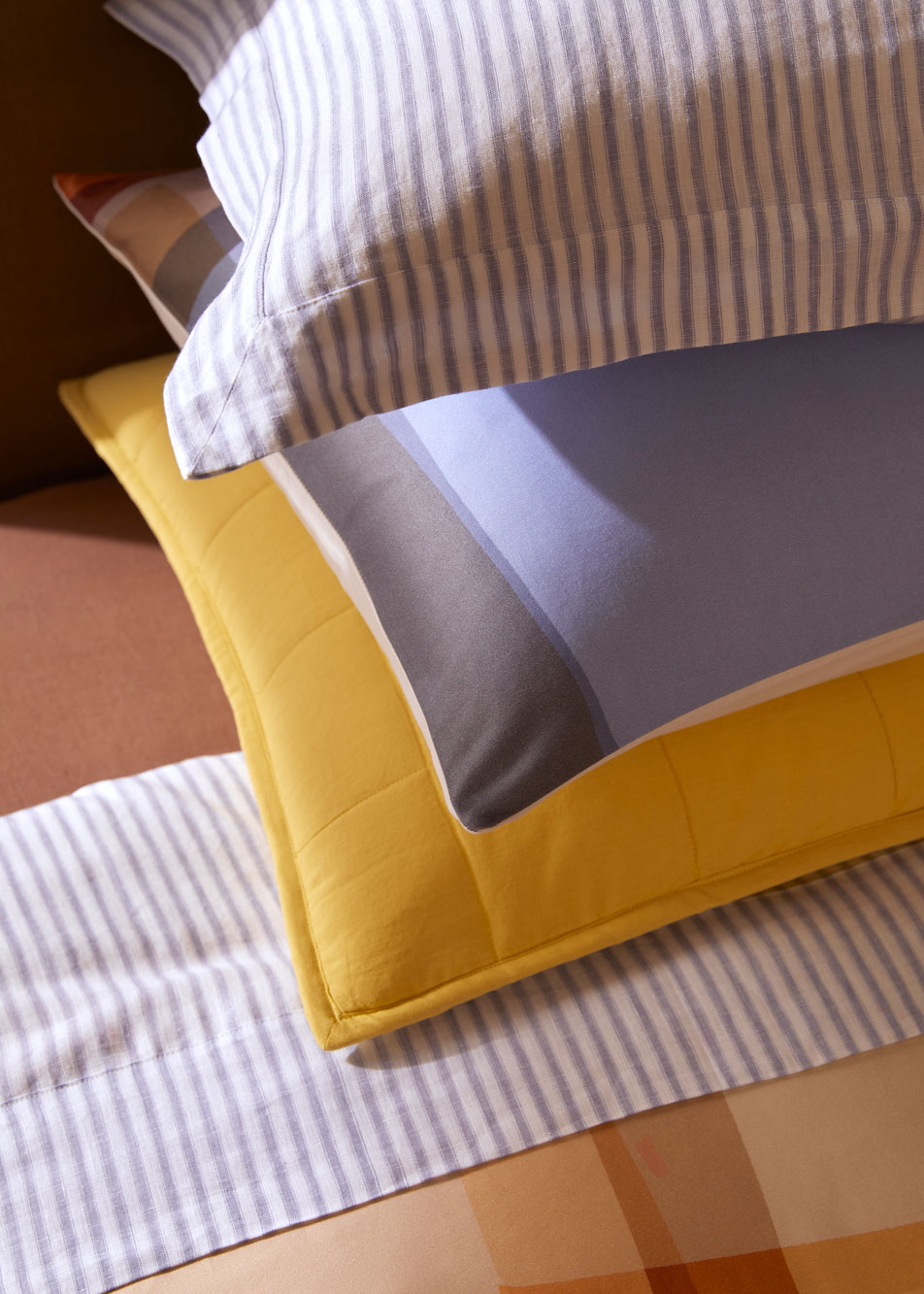 A close-up of several pillows