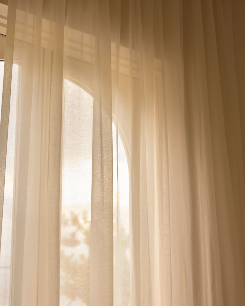 Sheer curtains in front of a window