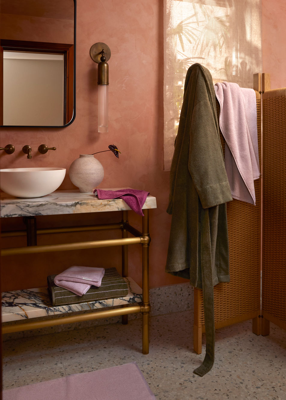 A bathroom with a sink and towel rack