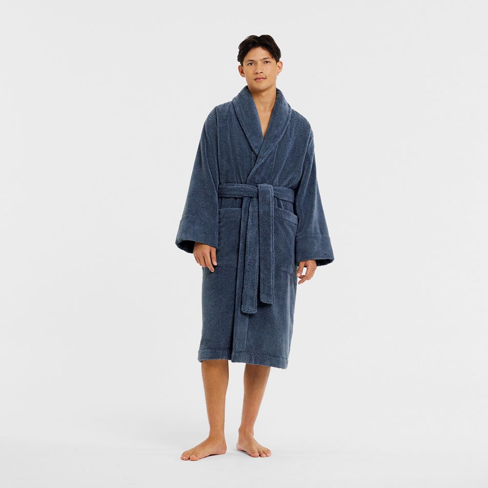 A male model wearing a navy bathrobe