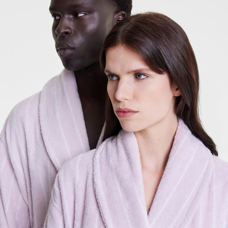 Close up image of two models wearing Aven Stripe bathrobes in lilac