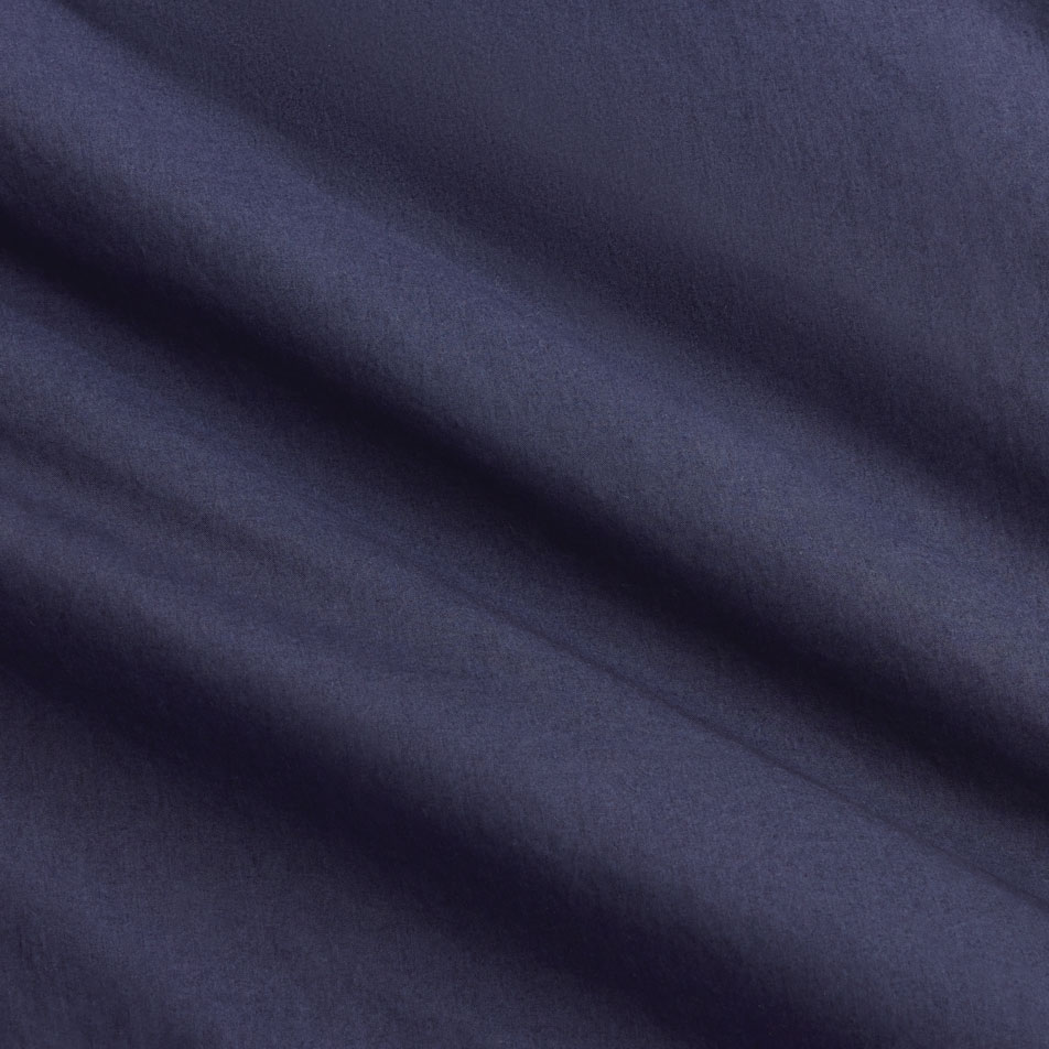 A close up of navy blue cotton percale fabric