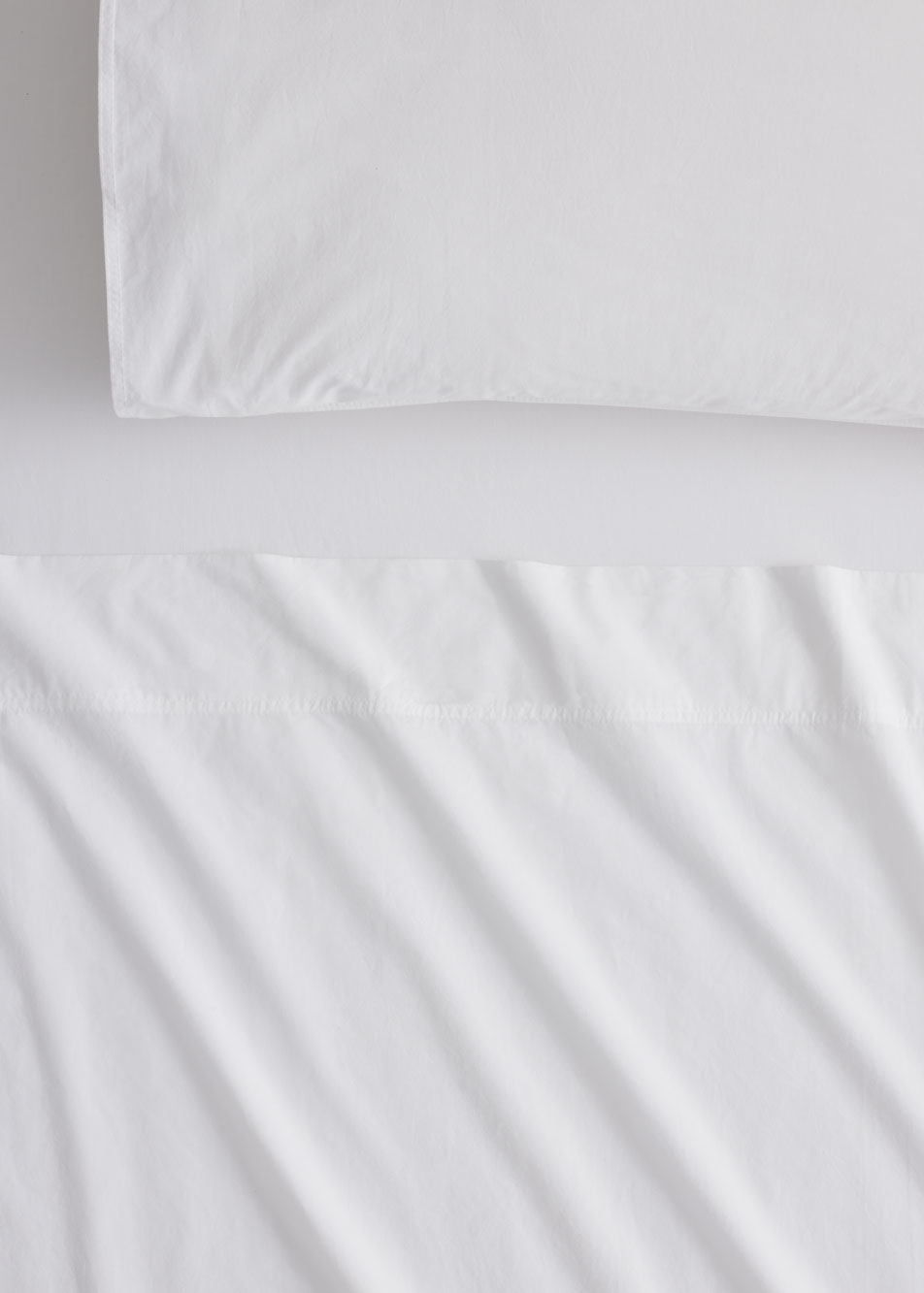 Close-up of Bayley Washed Percale sheets in white