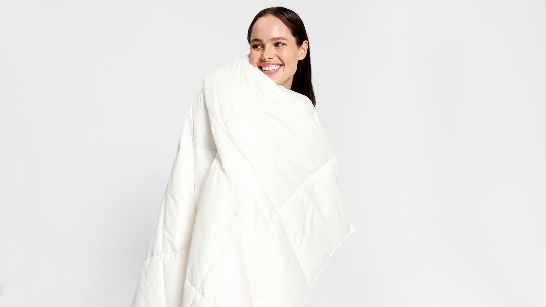 A woman wrapped in a Sheridan quilt