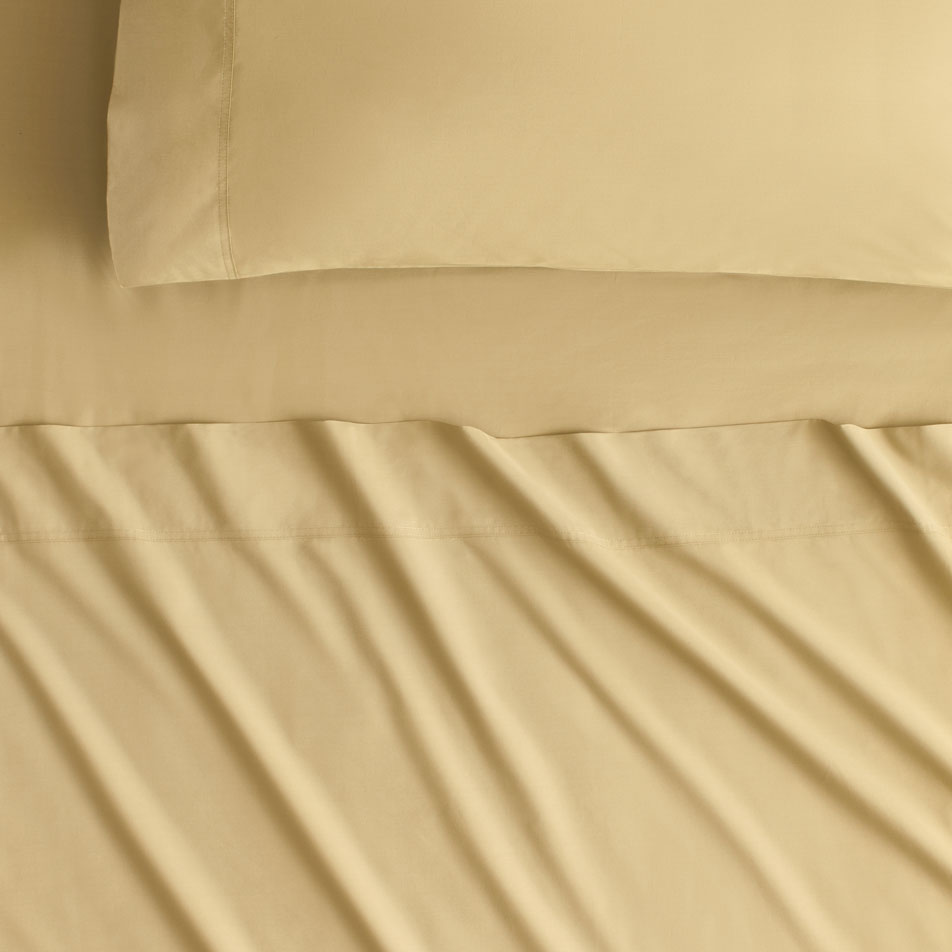 Close-up image of Byren Percale Sheets in colour straw.