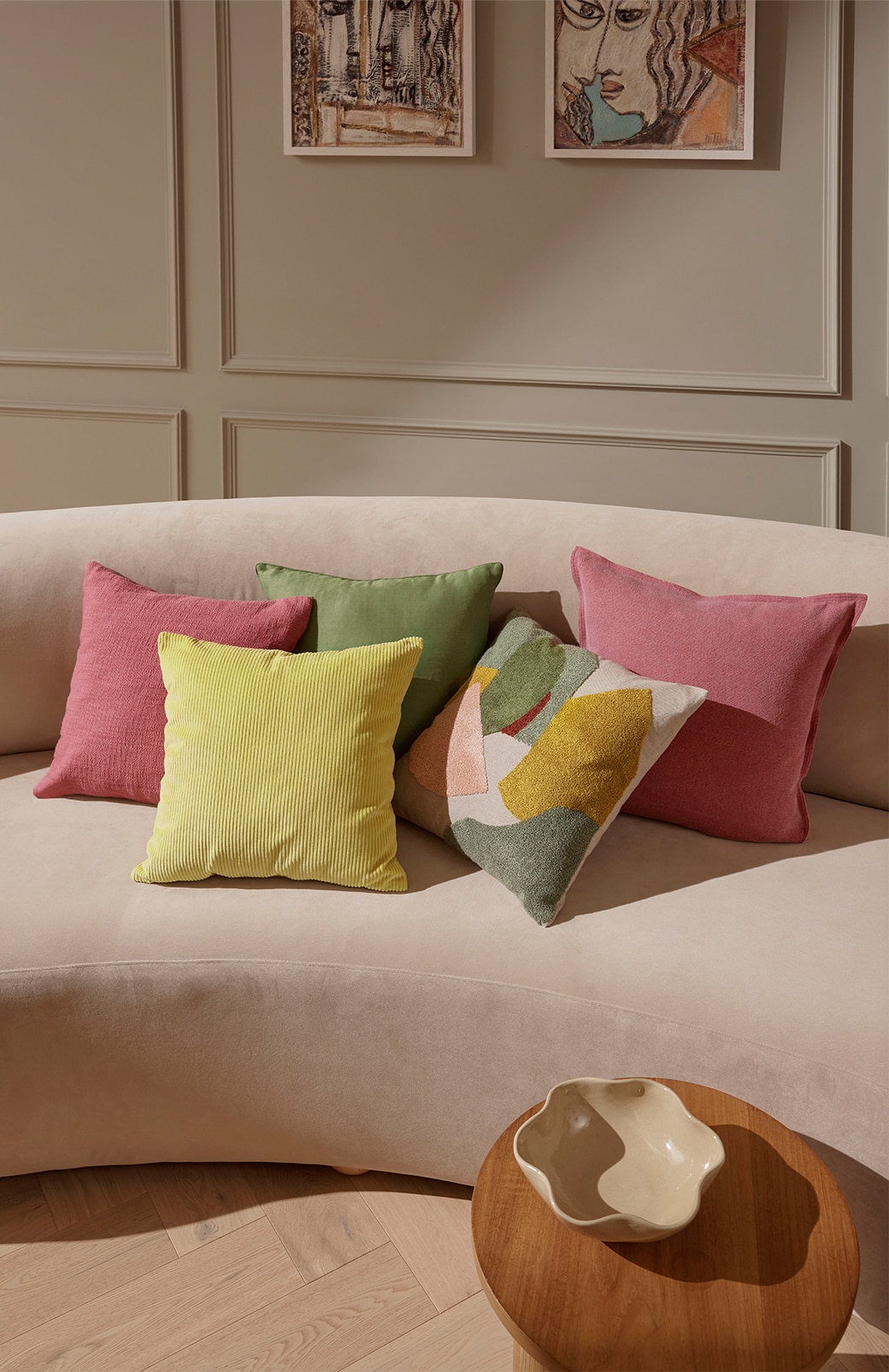 beige couch styled with multicoloured cushions in spring colour palette