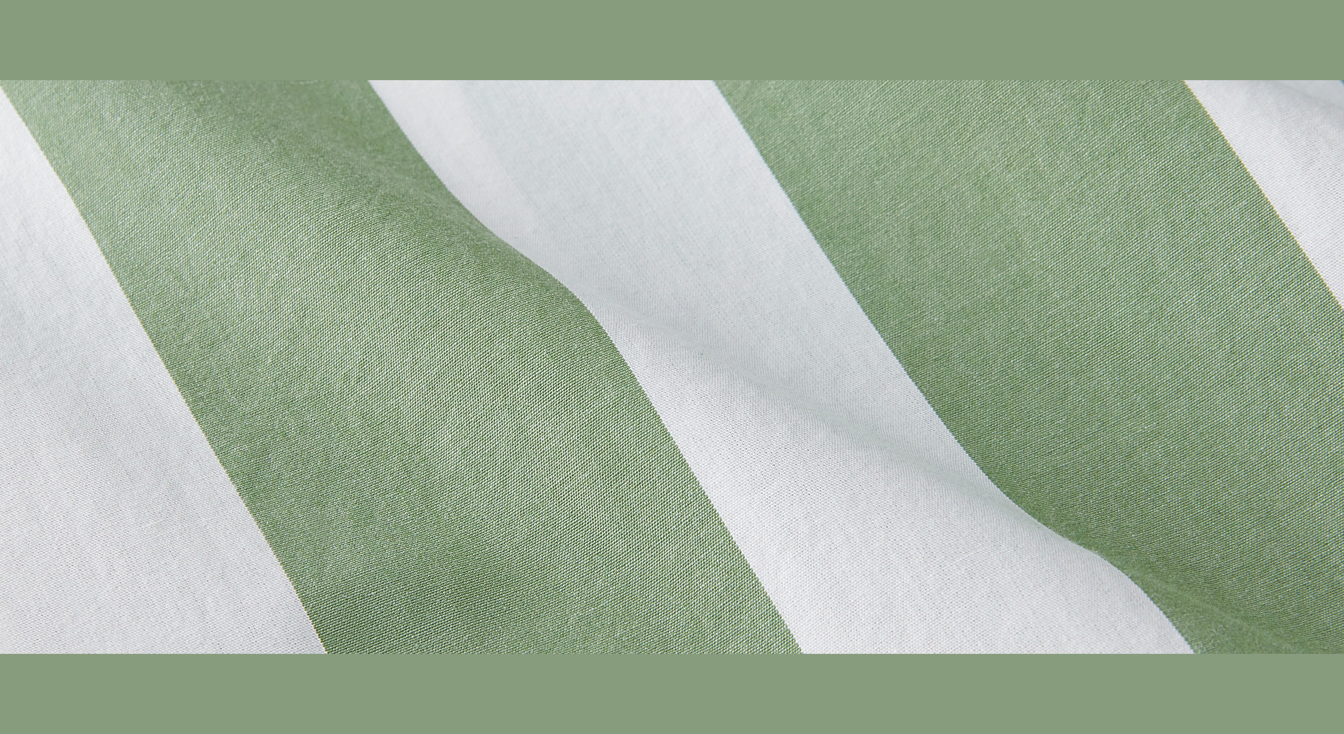 close up of cypress loungewears green and white stripe design. landscape picture is bordered by green on top and bottom. 