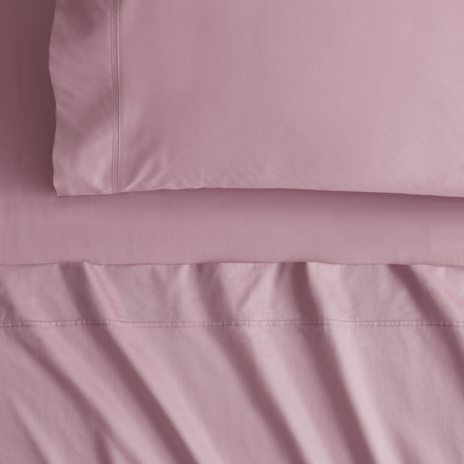 Close-up of Egyptian Cotton Sateen sheets in the colour tulip, a vibrant pink