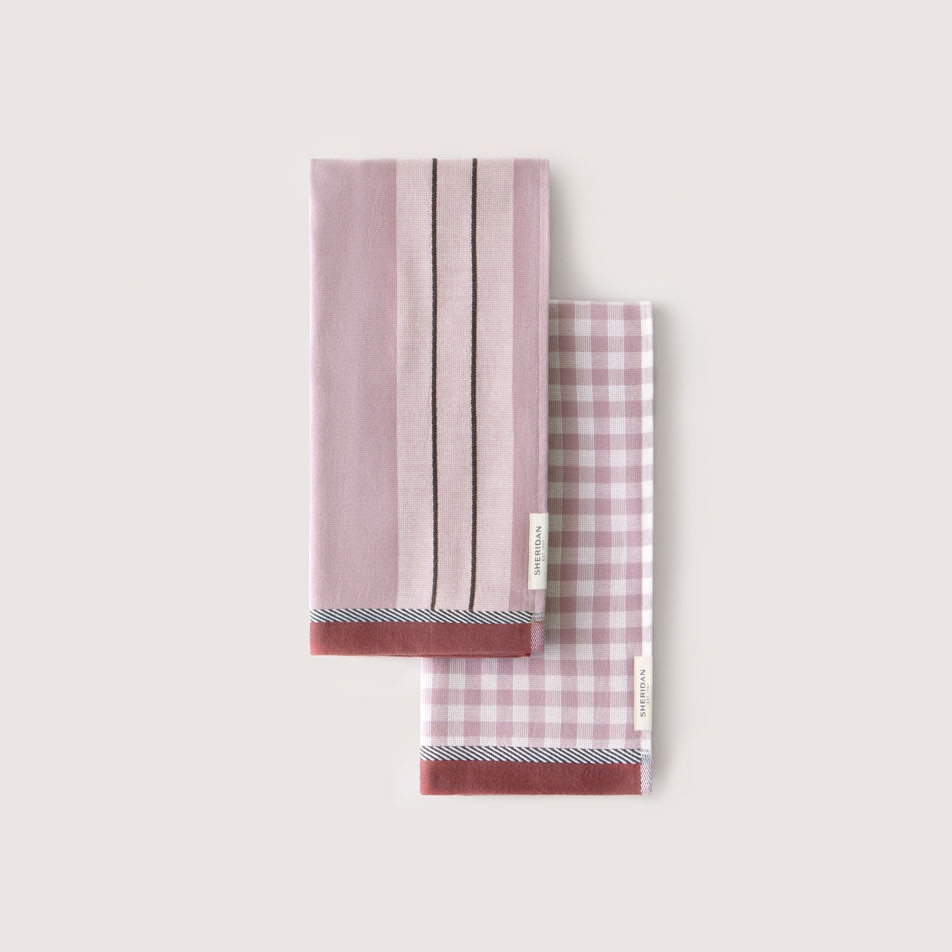 A flat lay image of a pair of Este tea towels in the colour lilac haze
