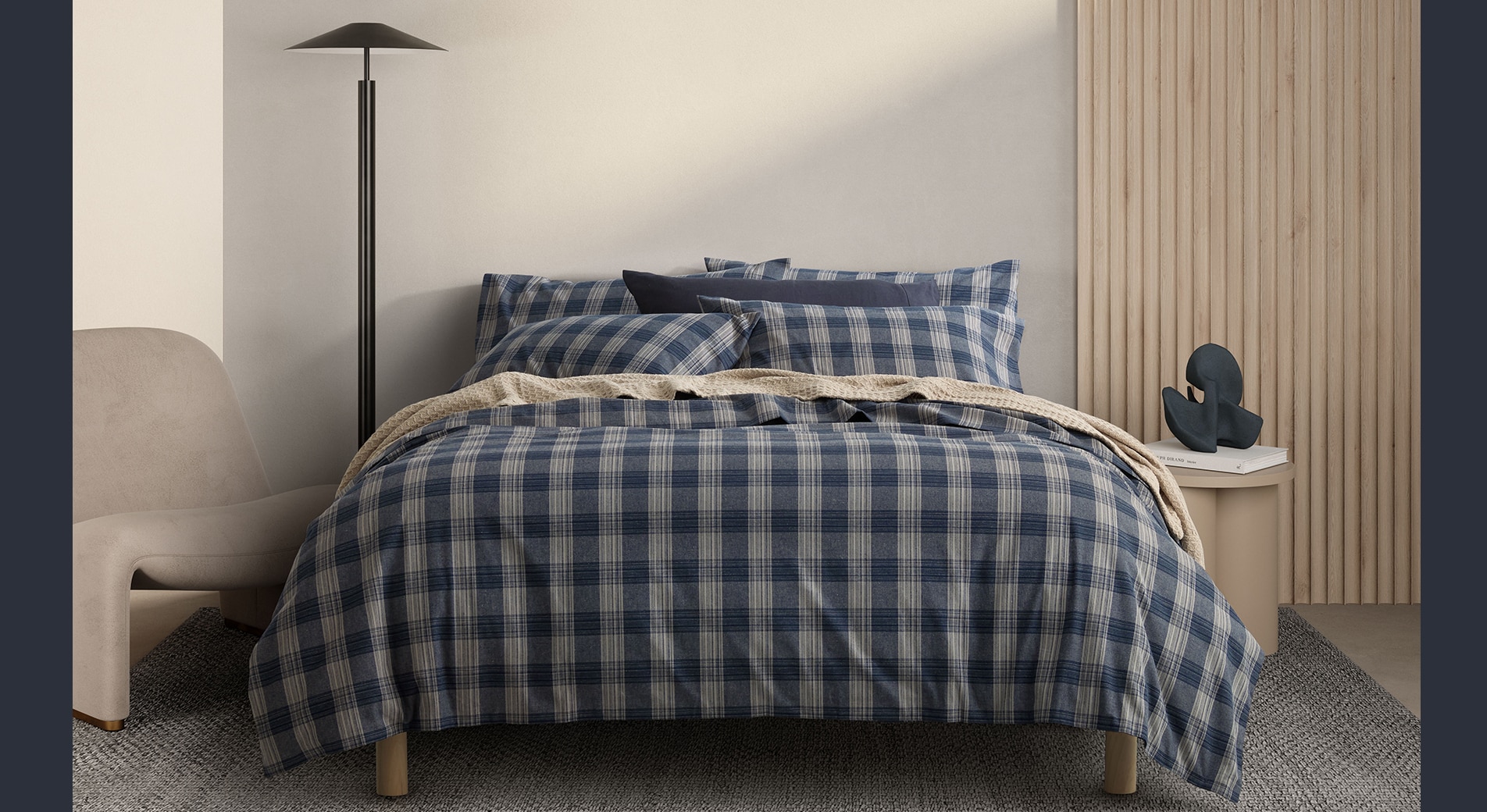 winter sheet material. styled shot of sheridan jennings flannelette quilt cover set, checked design.