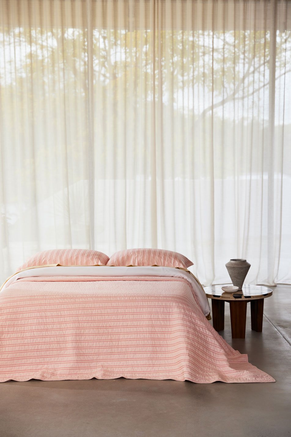 A pair of hands putting a flannelette quilt cover on a plush quilt