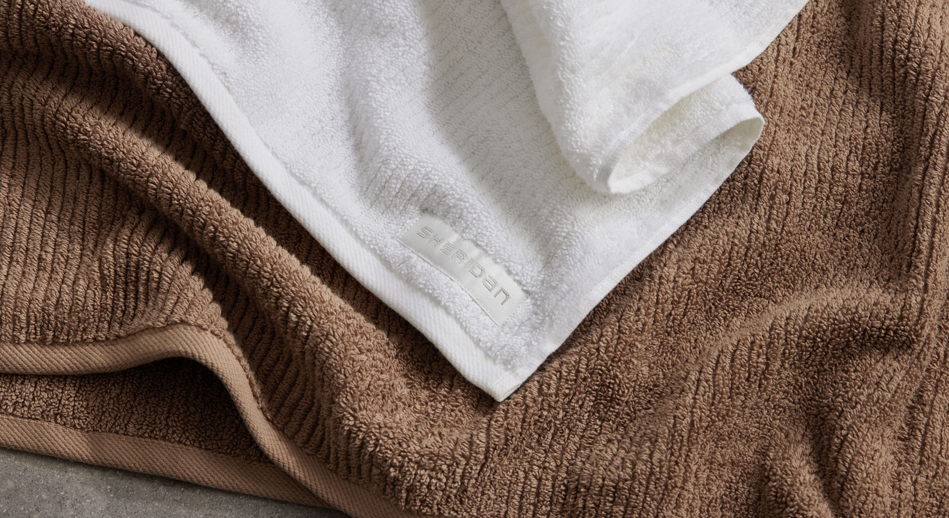 Detail image of living textures towels in brown and white