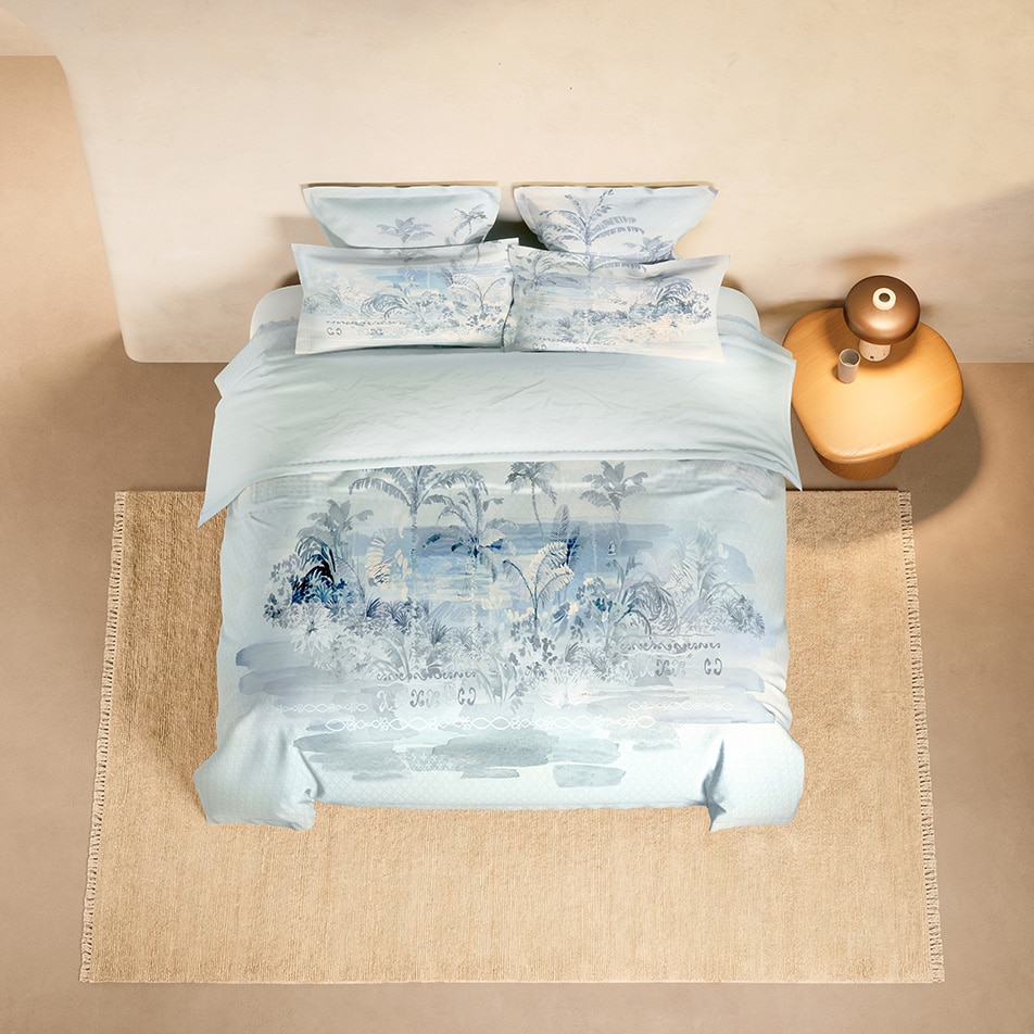 A bed showcasing the Longview quilt cover and coordinating pillowcases.