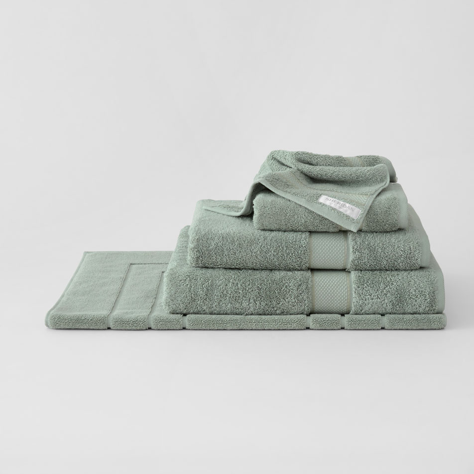 A stack of folded Luxury Egyptian towels in the colour dew