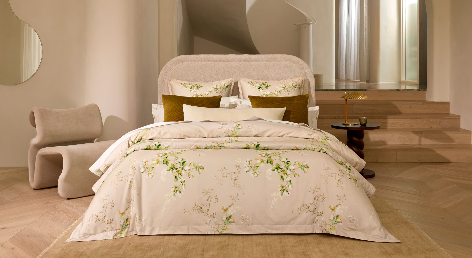 A a bed with floral sheets and pillowcases
