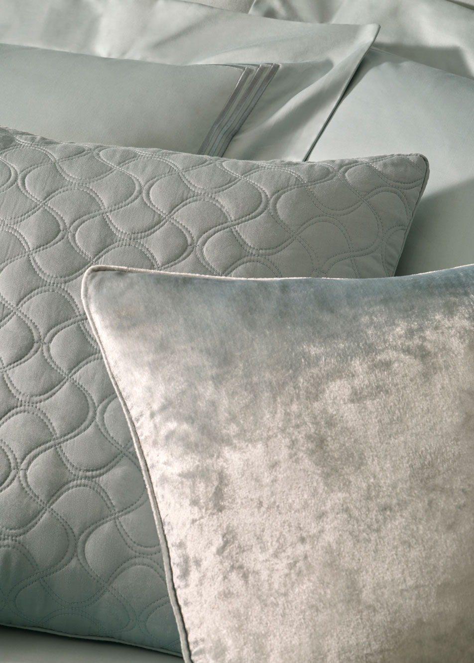 A close-up of several blue cushions