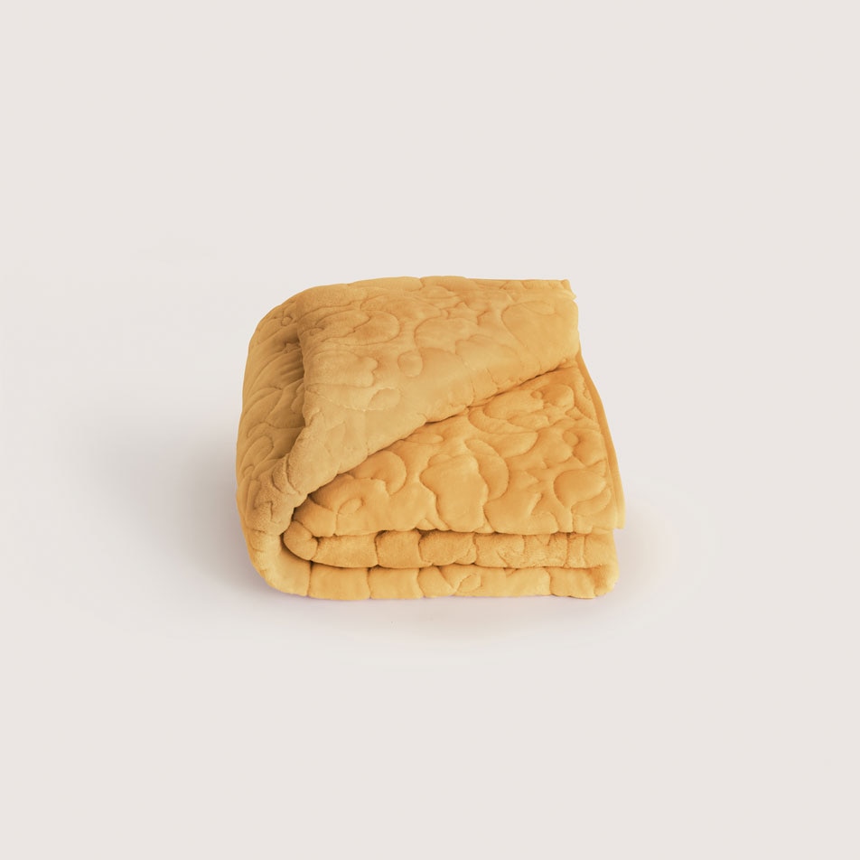 A Meriweather plush kids blanket in the colour honeycomb