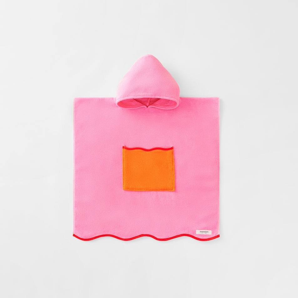 Ecommerce image of the Sheridan Ocean Waves beach poncho in the colour bloom.