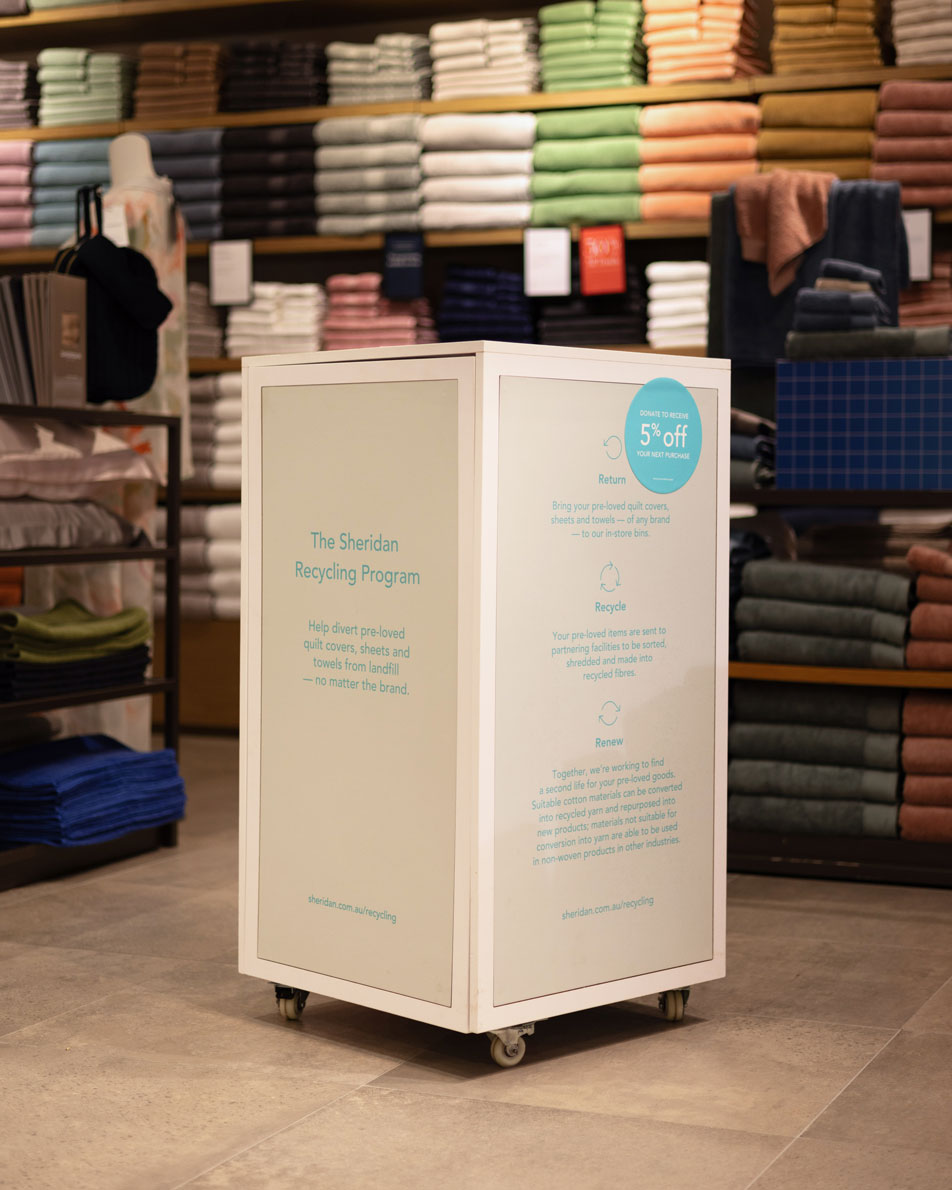 A Sheridan recycling box sitting inside a Sheridan retail store