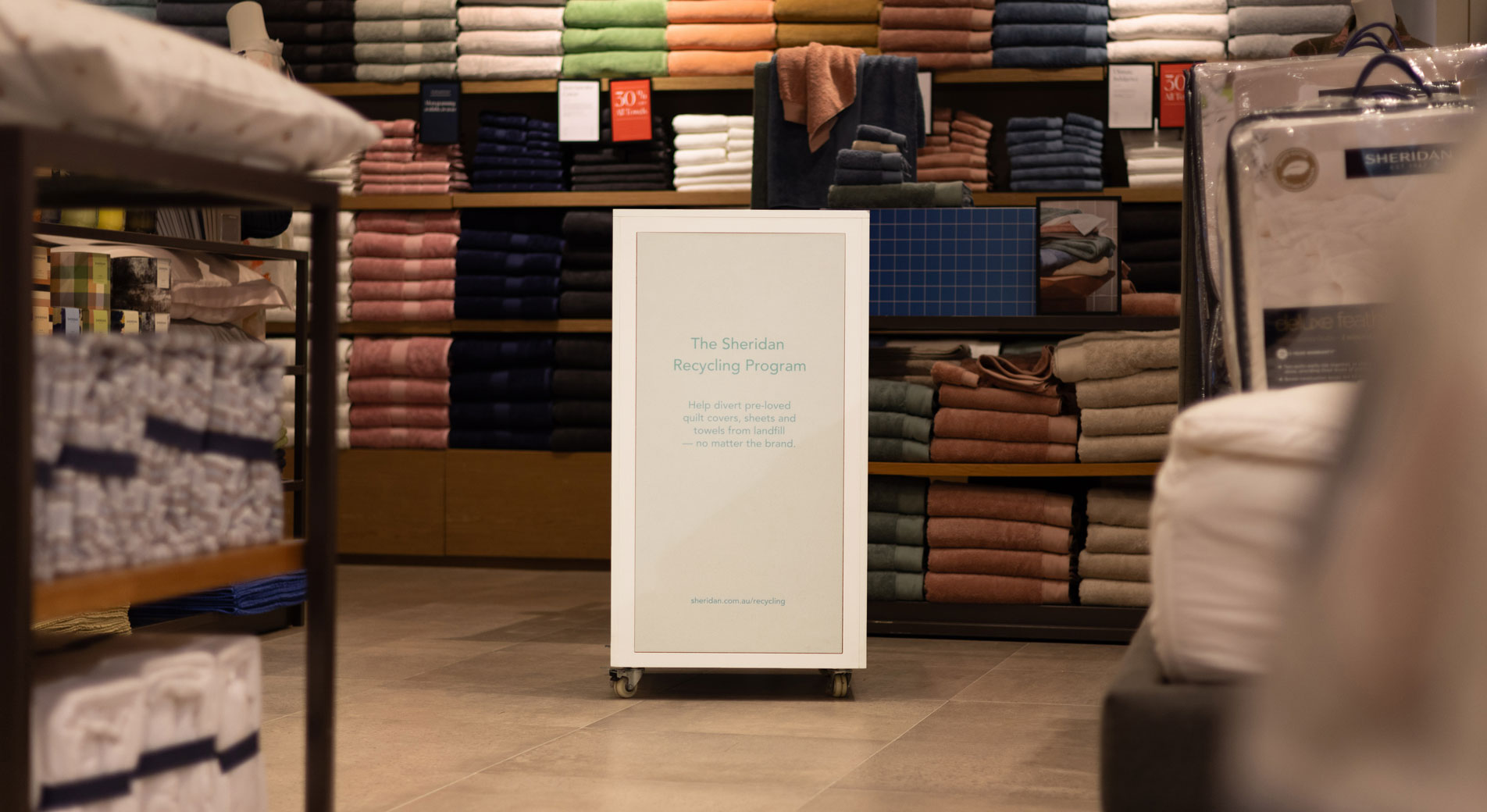 A Sheridan recycling box sitting inside a Sheridan retail store