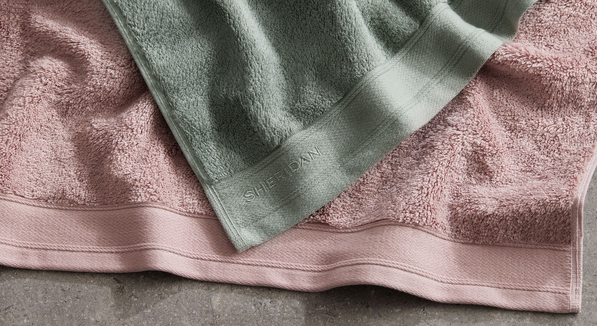 A close-up of two SuperSoft Luxury Towels laying on top of each other