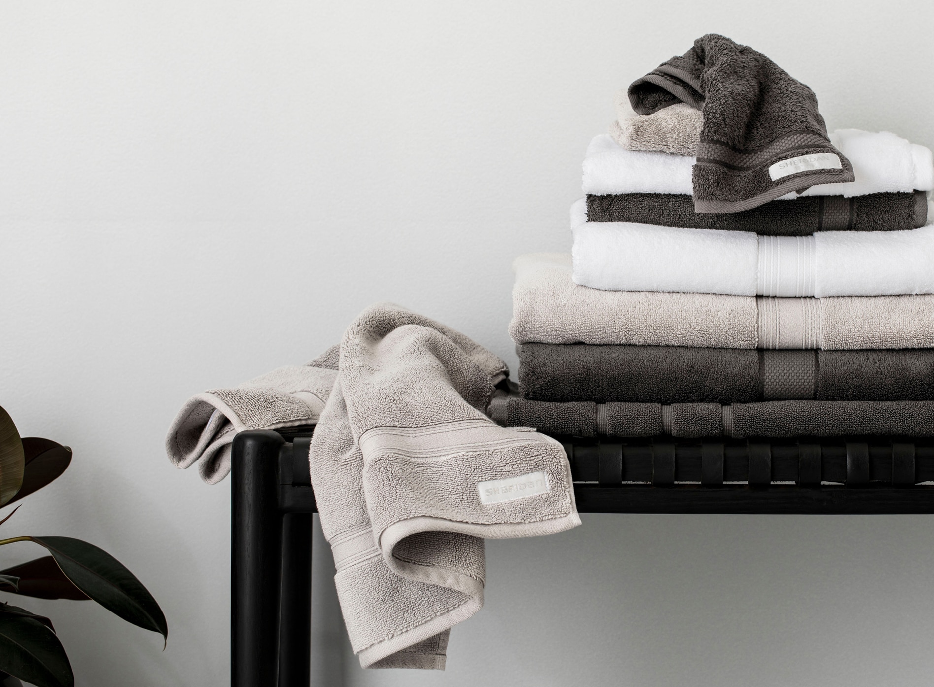 stack of luxury egyptian cotton towels in dark neutral shades