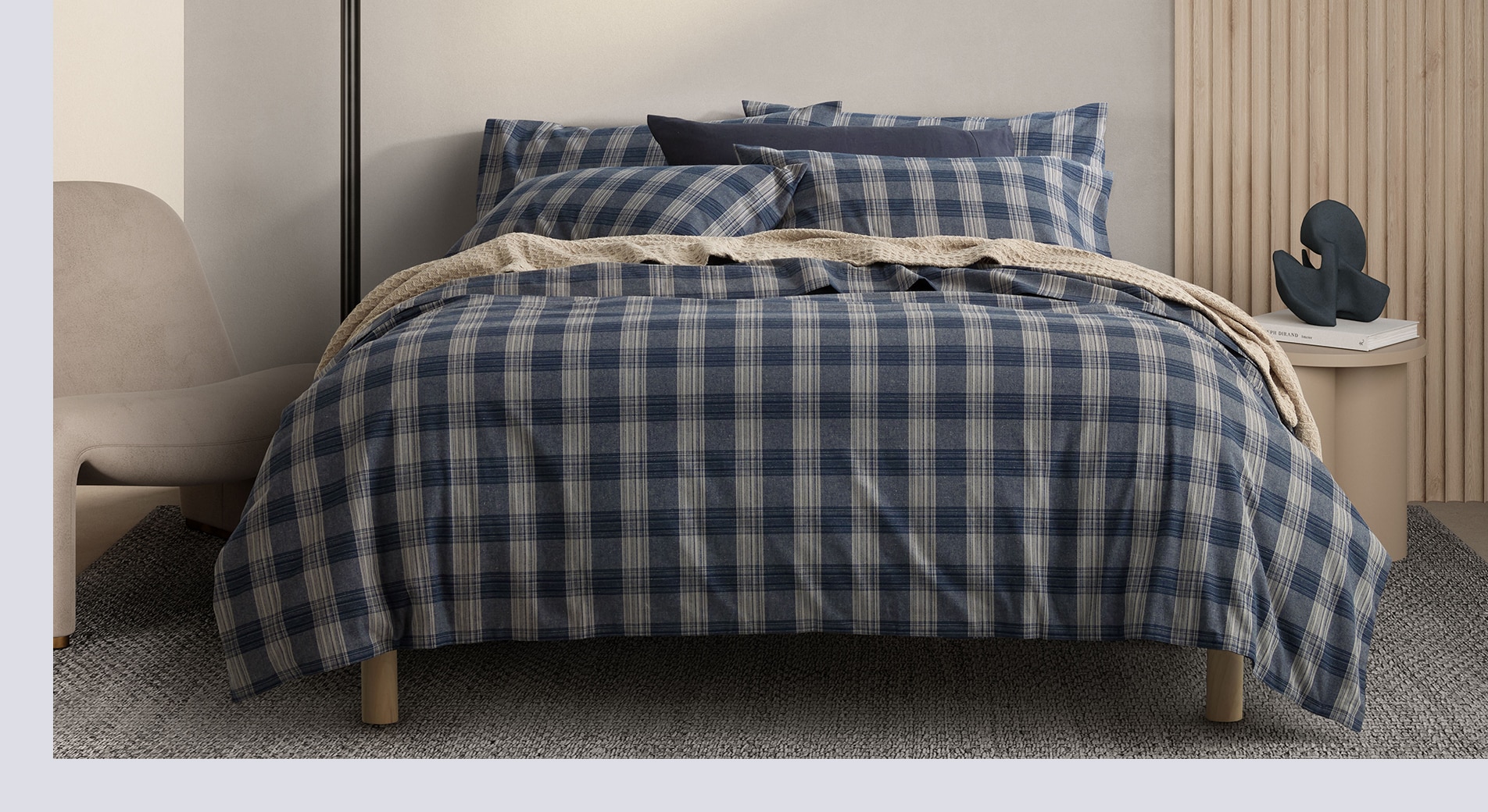 best sheets for winter. check flannelette sheets are styled on a bed, in beige bedroom.